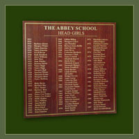 Head Girls honours board with gold lettering on red oak